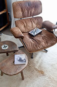 Classic leather armchair and set of wooden side tables
