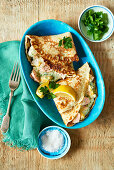Pancakes with fish and parsley