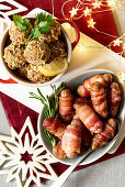Sausages wrapped in bacon and stuffing dumplings for Christmas