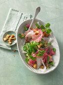 White radish salad with chioggia beets, croutons and lamb's lettuce with a maple syrup dressing