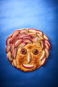 A fruit tart with a face