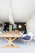 Wooden table and classic chairs in dining room