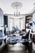 Upholstered chairs and side tables on a round rug in front of a fireplace, in the background workplace in the bay area