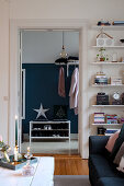 View from living room into hallway with two-tone wall