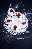 Raspberry cream in meringue nests