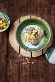 Cold almond soup with sesame seed dumplings, mango and lime-vanilla syrup