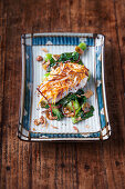 Red snapper with a sweet potato and coconut crust on bok choy