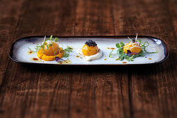 Cured egg yolks with a trio of vegetable purée