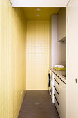 Washroom with yellow wall tiles