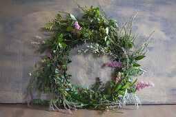 Green wreath with pink flowers