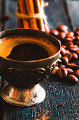 Cup of turkish coffee with sugar and cinnamon