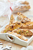 Biscotti with pistachios on a wooden tray