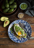 Toast with avocado, egg and greens