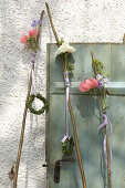 Peonies on wooden rods decorating door