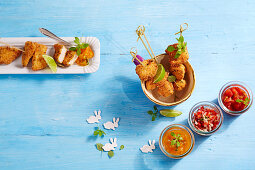 Breaded chicken skewers with three tomato dips for Easter
