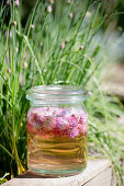 Jar of chive-flower vinegar