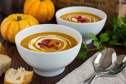 Cream of pumpkin soup with pomegranate seeds