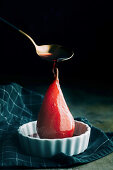 Poached pears in red wine with cinnamon and spices