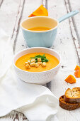 Pumpkin soup with croutons and basil