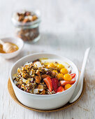 Cocoa-nib granola with coconut flakes and fruits