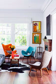 Retro seating, coffee table and animal fur rug in front of the fireplace in the living room