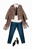 A silk blouse with a ruffled collar, jeans, a bouclé jacket and a scarf