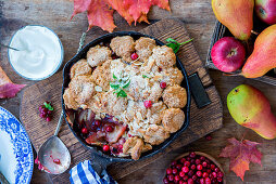 Autumnal pear and apple cobbler with cranberries (seen from above)