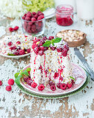 Small pistachio and raspberry roll as a vertical cake