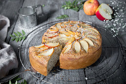 Wholemeal apple cake, slice, on a wire rack