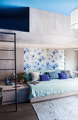 Modern, concrete bunk beds in blue and grey bedroom