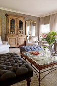 Ottoman and antique cabinet in classic living room