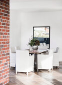 Dining area with slip chairs on French oak floors