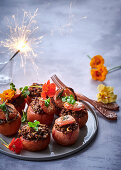 Whole tomatoes stuffed with lentils, pecans and hazelnuts