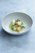 Delicate spring vegetables in a fine chervil nage