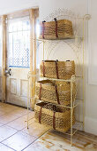 Square baskets on metal shelves next to front door