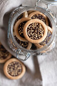Cookies with chocolate and hazelnut crumbs in a glass jar