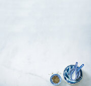 Blue and white dishes with Asian soup spoons and pepper mix