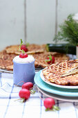 Spicy waffles served with radishes and a quark dip
