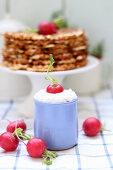 A quark dip with radishes served with spicy waffles