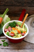 Savoy cabbage stew with carrots and smoked sausage
