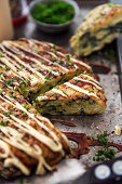 Okonomiyaki (spicy pancakes with cabbage, Japan)