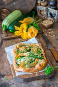 Zucchini flower pie with pine nuts