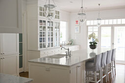 Bright, white country-house kitchen