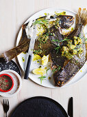 Whole-roasted flounder with caper, anchovy and herb butter