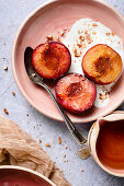 Roasted Red Plums and Greek Yogurt in pink bowls