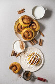 Homemade pumpkin cinnamon bun rolls sweet autumn baked dessert with cream cheese sauce