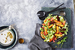 Crumbed haloumi and ruby grapefruit and rocket salad