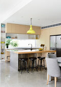 Bright, open kitchen with counter and polished concrete floor