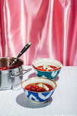 Borsch (Russian beetroot stew) in bowls, served with sour cream and dill