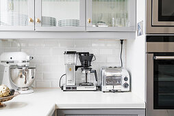 Various kitchen applicances on a white worksurface